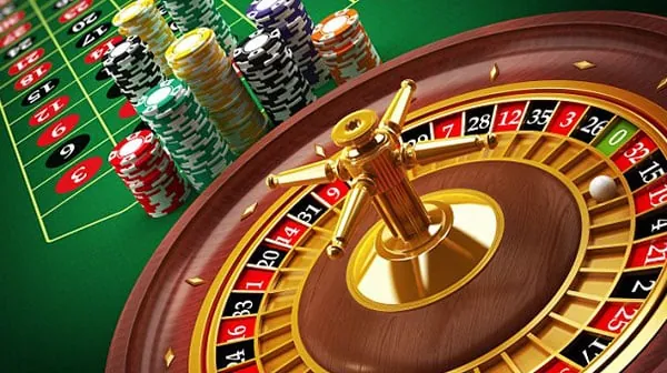 Hand holding a golden coin with 'bonus' text